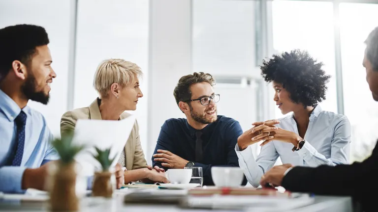 People sitting around a table talking to each other